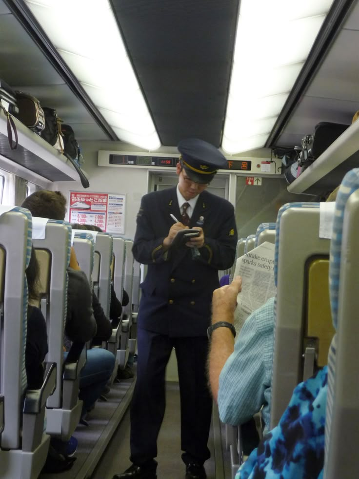 Japanese railway conductor at work.