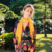 Author Marina Lizio portrait with Japanese garden background