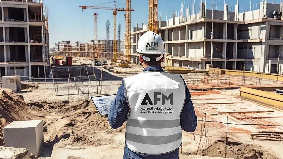 Construction worker with "AFM" vest and helmet holds a tablet, surveying a building site with cranes and unfinished structures under blue sky.