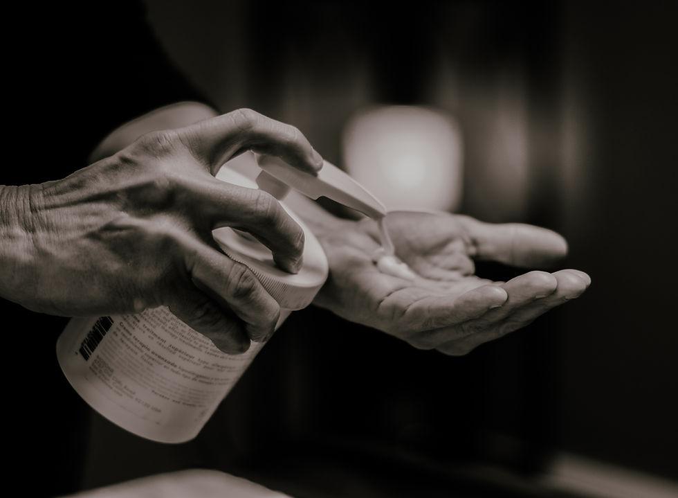 Massage Lotion in massage therapist's hands