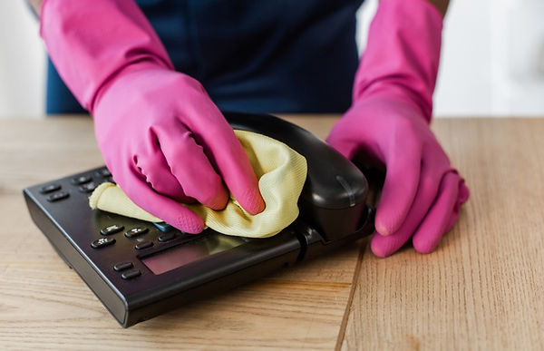 Collage of multiethnic cleaners cleaning telephone and computer keyboard in office_edited.
