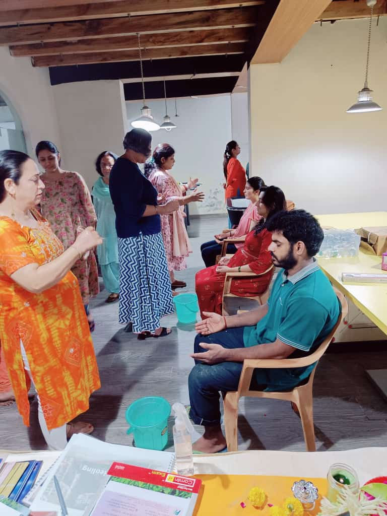 High angle view of hands performing energy healing over a person lying down