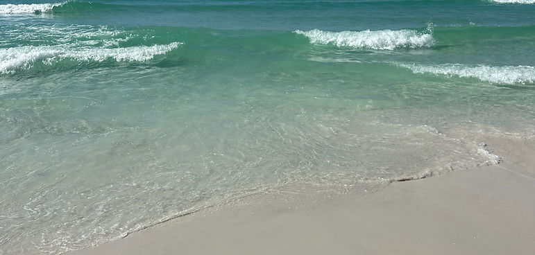Emerald water and white sand shoreline in 30A Florida, photographed under clear blue sky for FIT30A wellness and fitness shop banner