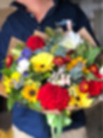 Bright red, yellow, orange flowers. Sunflowers, Dahlias, Statice, Stock