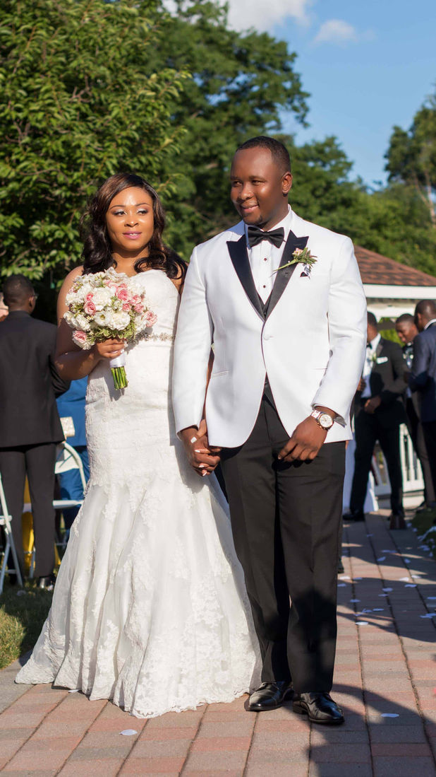 A married couple walking down the aisle after their wedding ceremony in NJ, captured by a wedding photographer.
