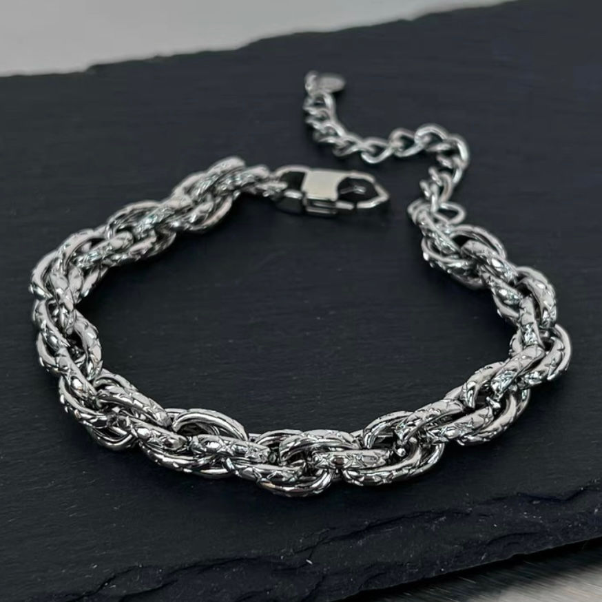 Thumbnail: Twisted diamond-shaped titanium steel bracelet for men and women