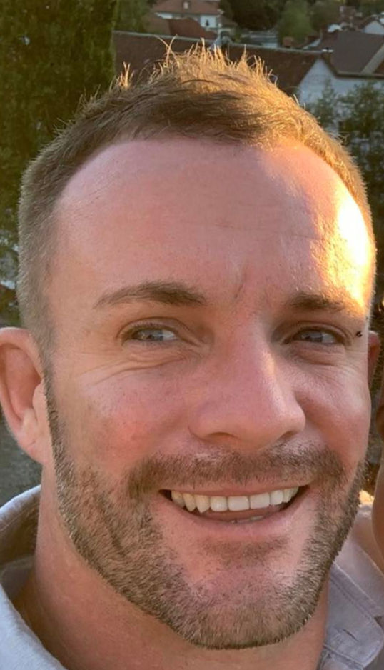 Smiling Simon's headshot