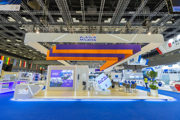 Blue exhibition stand design at indoor trade show venue built by Procyon Creations