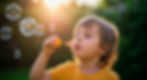 happy-kid-blowing-bubbles-sunlight