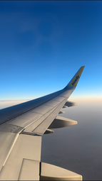 Airplane wing view in the sky, travel journey and vacation flight experience