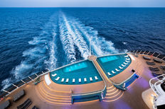 Cruise ship pool deck with ocean view, luxury cruise travel experience
