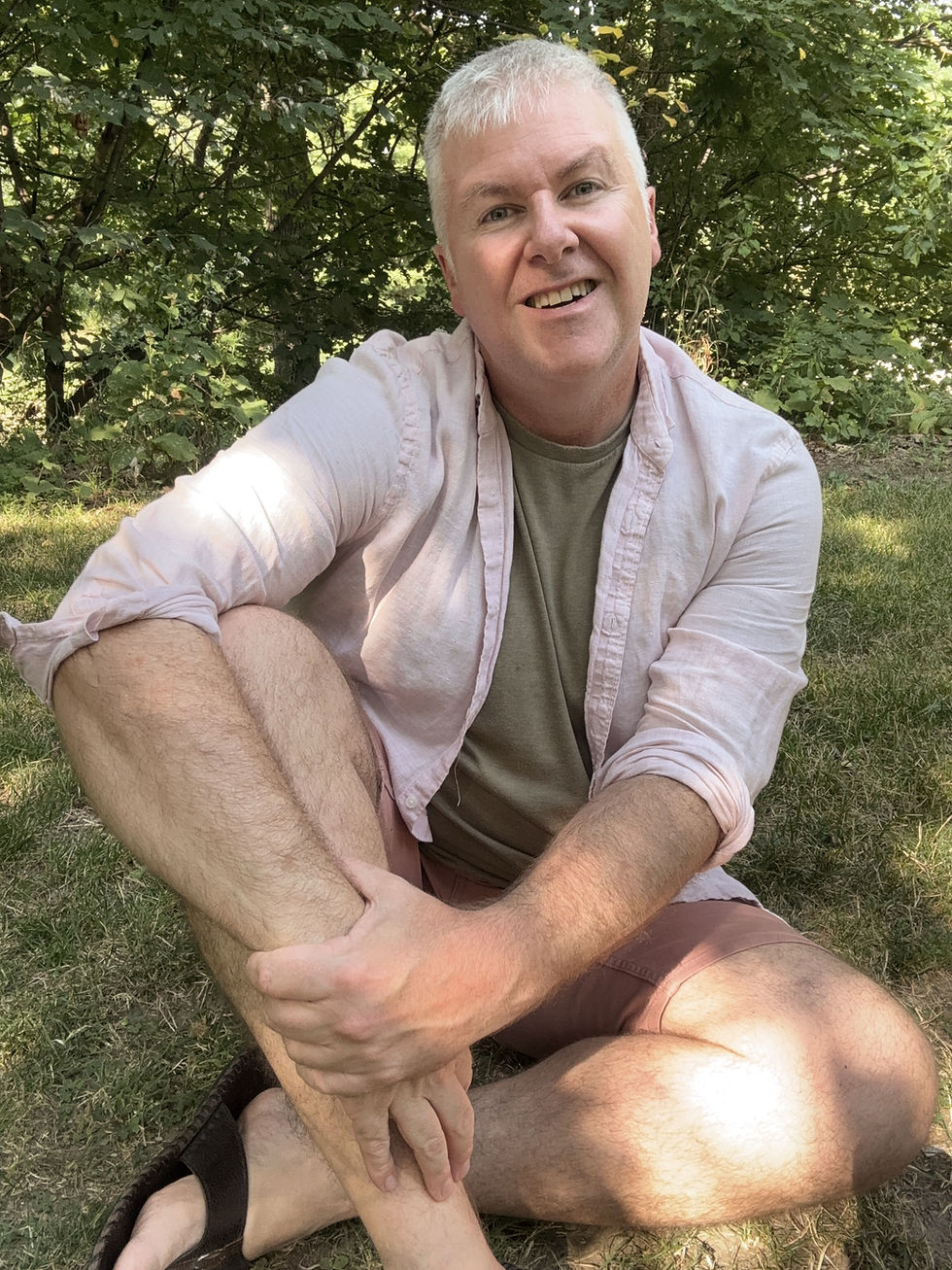 Portrait of Jean-Francois Alleno with a lush green background