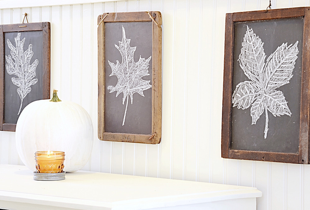 Vintage children's chalkboards decorated in entryway for fall.