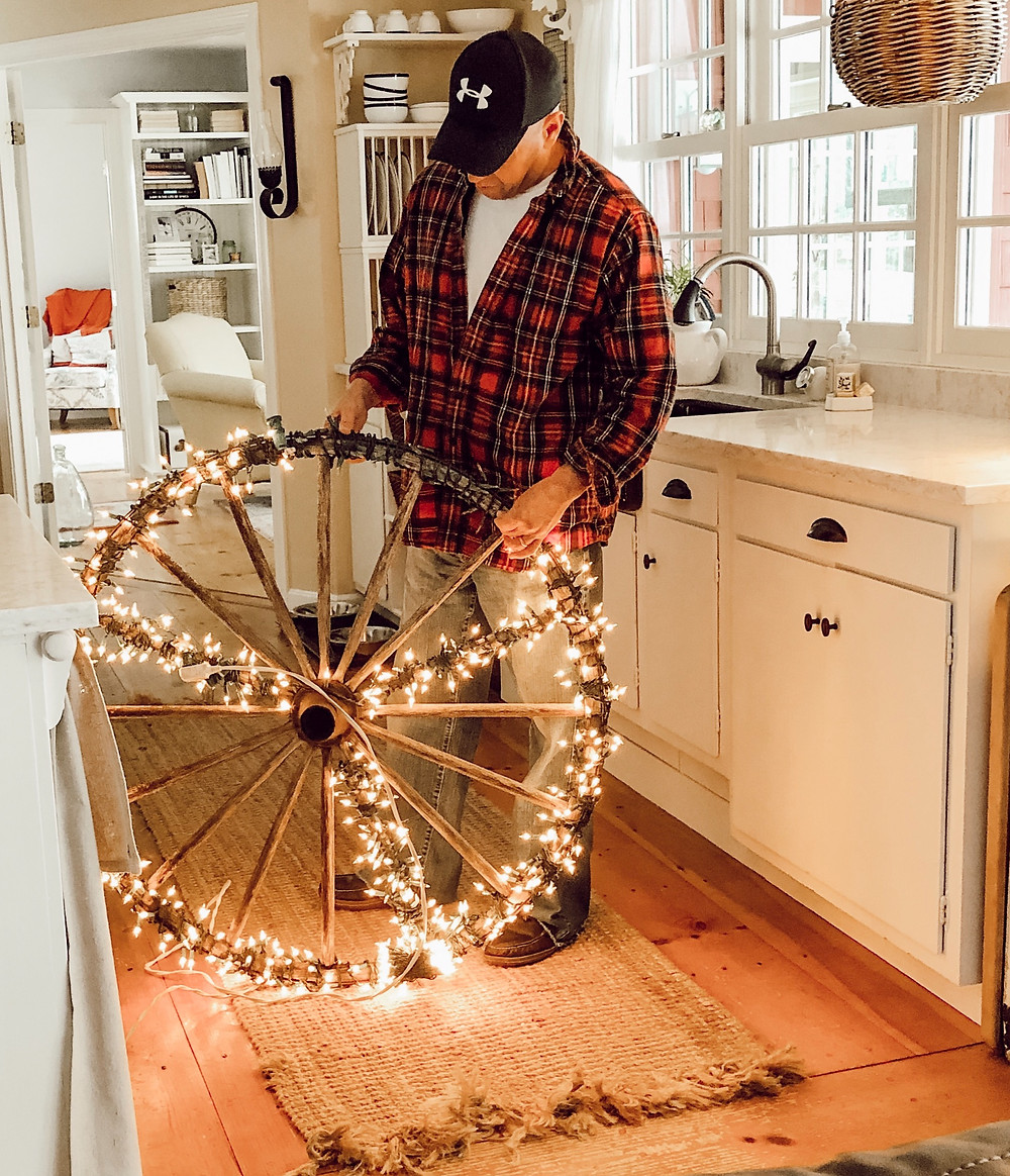 DIY Christmas Peace Sign with Vintage Wagon Wheel and White Lights.