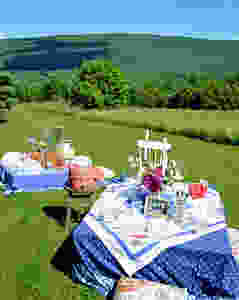 Pallet picnic tables decorated in the mountains.