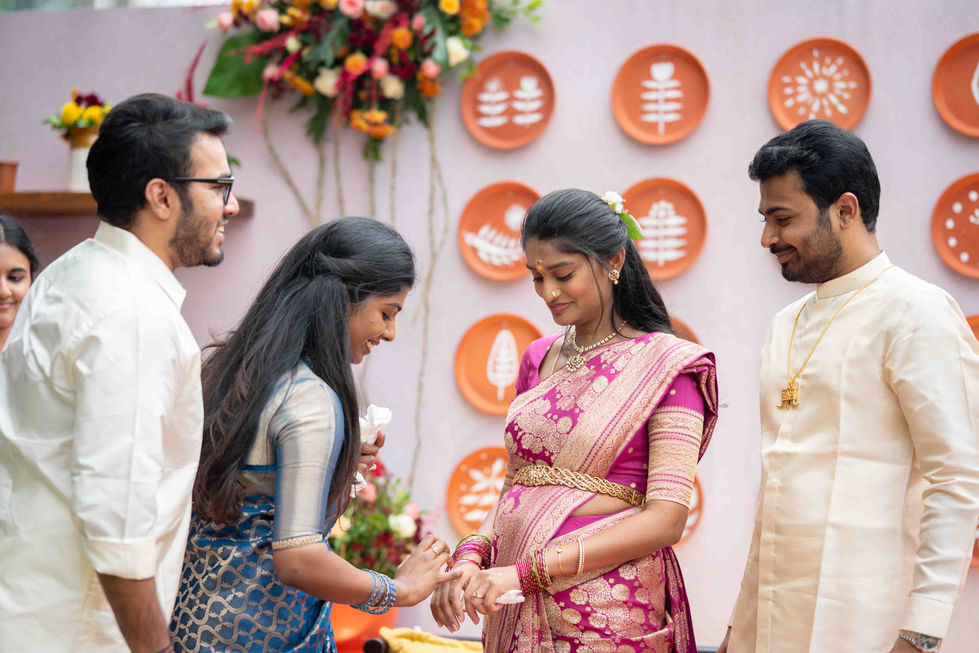 Four people celebrating at a festive event.