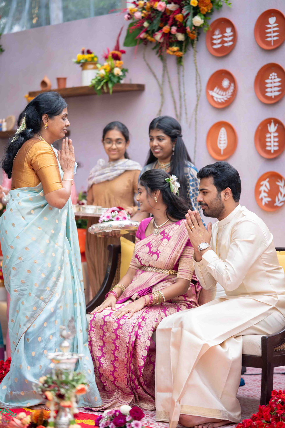 People in traditional attire at a cultural ceremony.