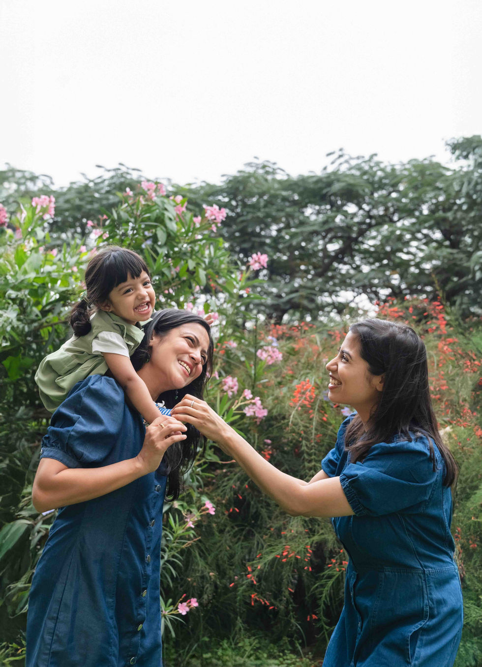 Family enjoying time together in a garden.
