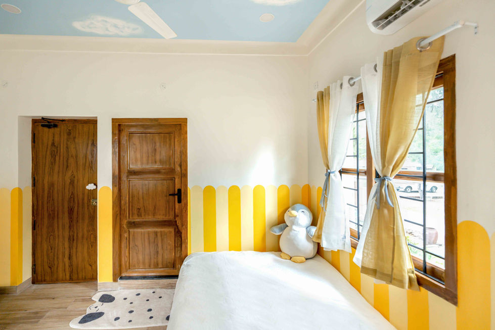 Bright room with yellow accents and a plush toy.