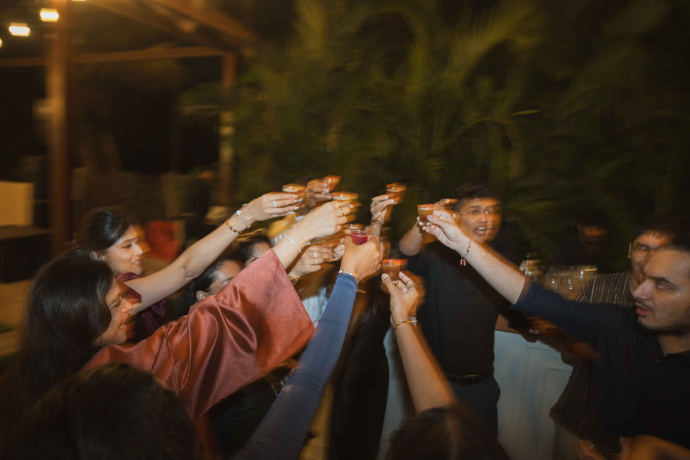 People raising glasses in a celebratory toast.
