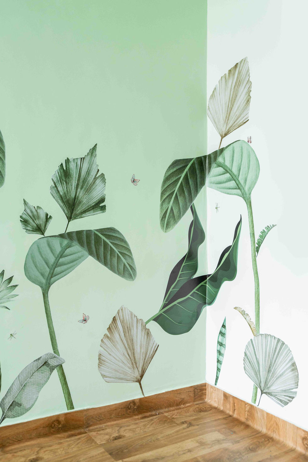 Illustrated green leaves on a light background.