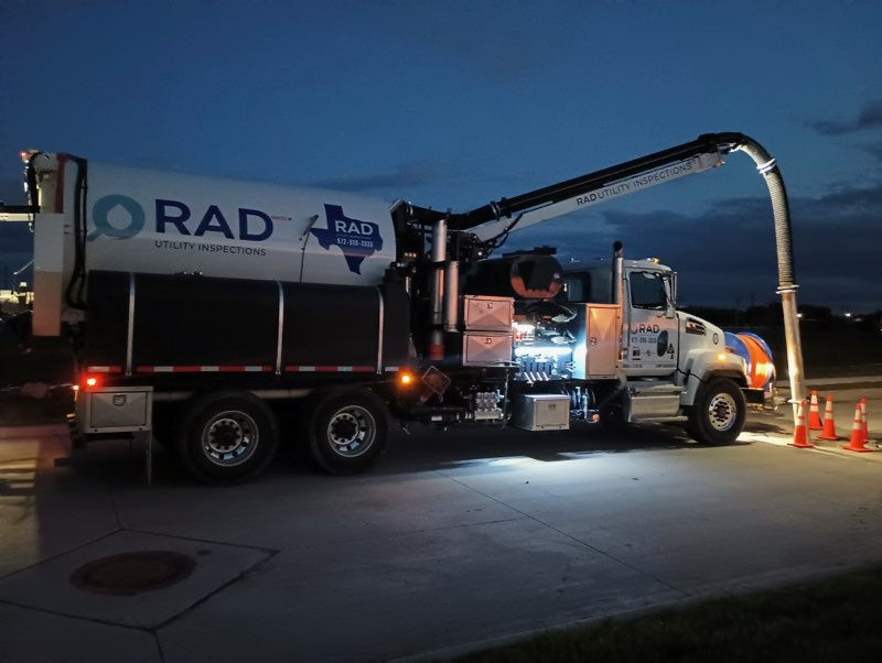 Image of a very large RAD Utility Inspections truck performing hydro excavation.