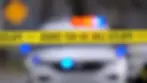 Police Line Tape in front of police car