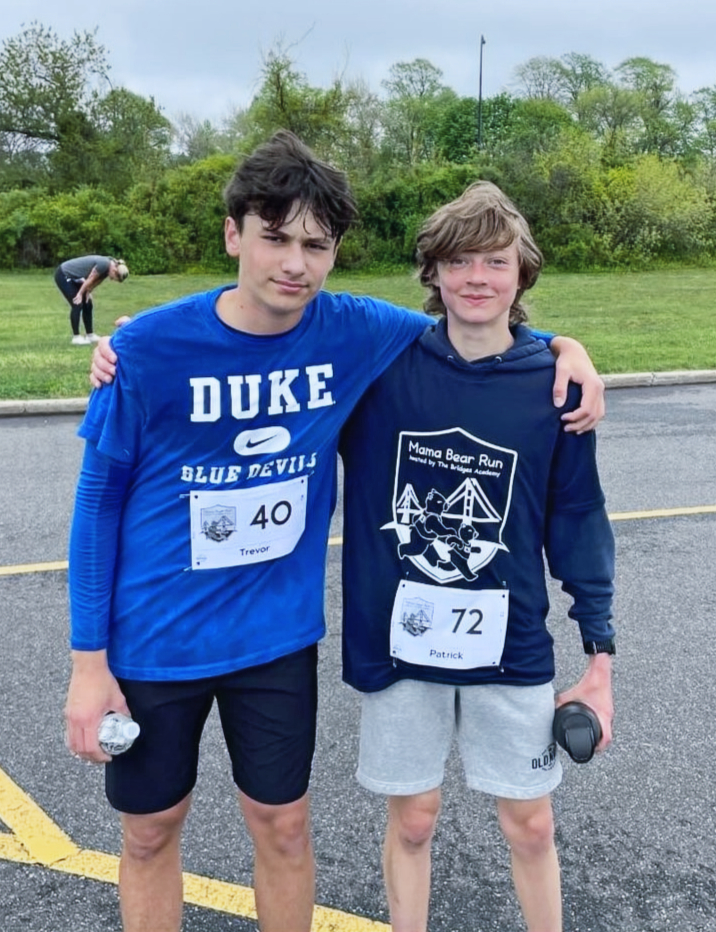 Two students running in a community event