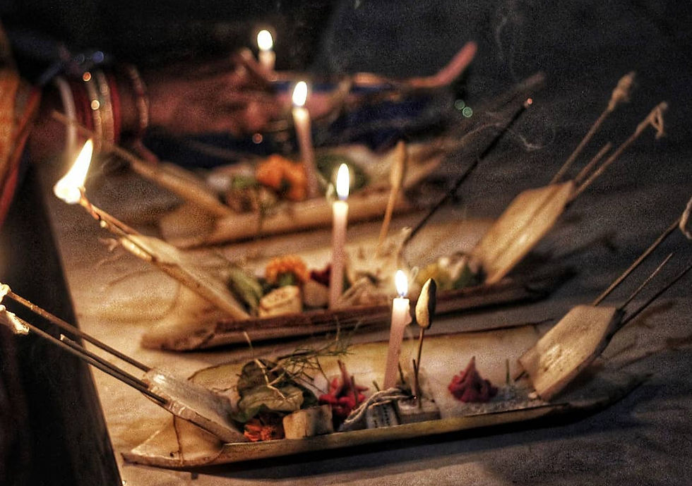 Banana-bark boats carrying lamps and offerings during Boita Bandana