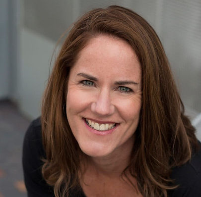 Karen Conklin-Johnson, LPC wearing a black shirt smiling with shoulder length reddish brown hair