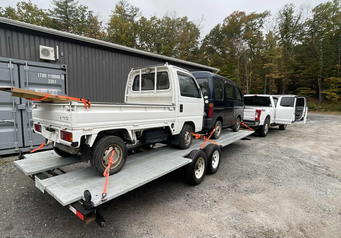 Ford F250 Towing 2 Kei Vehicles