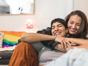 A lesbian couple in a warm embrace