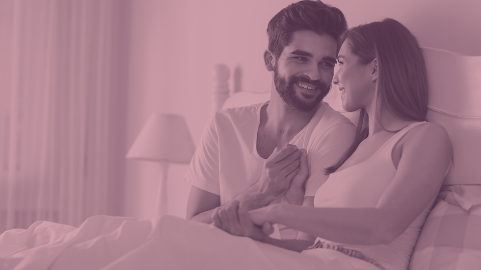 A couple talking in bed