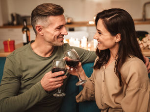 A couple drinking wine at home