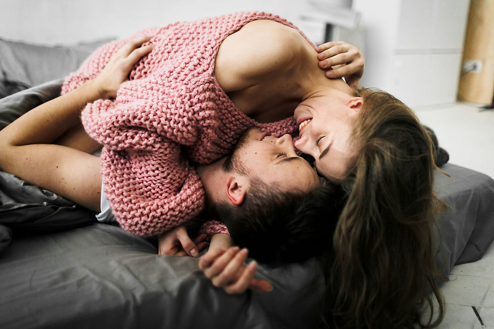 A couple engaging in romantic foreplay