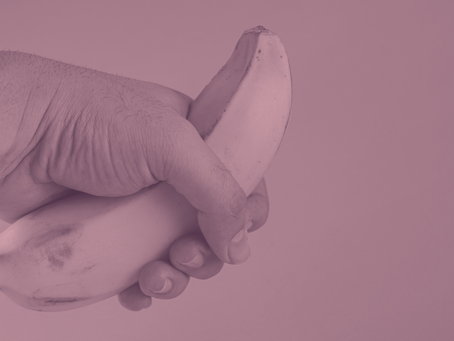 A man holding a banana.