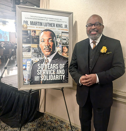 50th_Kerry_in_Front_of_MLK_Poster.jpg
