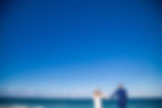 Destination wedding couple in Cancun looking out to the ocean
