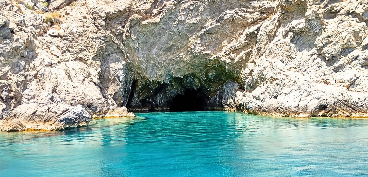 Sea cave with crystal clear water during South Crete sailing experience near Agia Galini