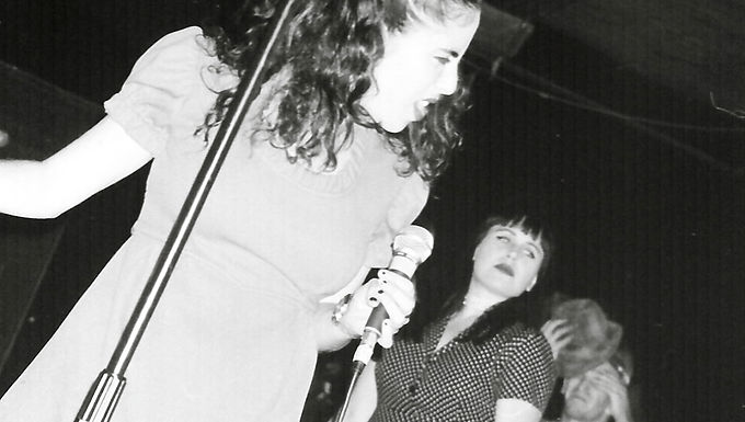 Throughout music history, music genres have always been associated with subcultures. The rock genre was associated with youth culture in the 50s, hair metal played up on the glam aspects of 80s culture, and emo became known for its overzealous fans wearing makeup in the 90s. Ska as a music category is no different. However, its association with many subcultures in other societies makes ska an exciting music genre for scholarly study. Ska, as a genre, is a little over 60 years old and known in Jamaica, Great Britain, and the U.S., and is associated with three different subsets of groups that have their differences. However, these differences, while minor, helped form the so-called three waves of ska and the subcultures. In the history of the genre, there was a connection between the "Rude Boys" of Jamaica, the skinheads of England, and the punks of the U.S. The identity of ska is an evolution of other musical formats: Mento and R&B. Originating out of Jamaica, the genre became a combination of Jamaican folk music, mento, and a fusion of R&B from the U.S. (Kauppila, 2006). Early R&B brought together the elements of jazz and blues by associating itself with brass instruments. The staple of ska, even to this day, is brass instruments, with bands such as Less Than Jake utilizing the trombone and saxophone in most of their songs. In addition to these brass instruments, the beat's style differs from other genres. The main emphasis of ska, and one of its spin-off genres, reggae, is the "offbeat," which emphasizes the second and fourth beats in a regular 4/4 time well known to R&B, rock, and country (Keyes, 2003). With this differentiation in music, the new style started to take root in Jamaica. Figure 1.  Dance Hall Patrons Dancing to Ska Music From the Era of the "Rude Boys" The first introduction of ska in Jamaica happened in the early 1960s. The name came from Cluett Johnson, a member of the Blues Blasters, who greeted patrons at shows with the call of "Love Skavoovie" (Kauppila, 2006). Thought of as a passing phase of music, which would become a recurring theme for the genre, the "rude boy" subculture latched onto the music. This societal sect saw ska and its musicians as a review of the injustices of the socio-economic issues of the lower classes in Jamaica (Boxill, 1994). In addition, they also became disillusioned with the ruling classes (White, 1967). One example of their disenchantment with the ruling system was the Duke Reid Group's song "The Rude Boy," which espouses lyrics regarding eviction and living in the ghetto. The music spoke, and this subculture listened, chanted the lyrics, and made people such as Jimmy Cliff national folk heroes for their inclusion of the economic struggles of "rude boys" in their songs (Boxill, 1994). The idea of the "rude boy" continued in Jamaican culture, but their ideas transferred throughout the world, along with the ska genre. While the common identification of skinheads is now more known for racism, the subculture itself did not start as such. The skinhead culture surfaced in London's East End roughly around 1968 and revolved around traditional working-class values (Calluori, 1985). Due to similar disillusionment with the status quo and social changes, there was a connection between the skinheads to the rude boys of Jamaica. They found a similar expressive tone to Jamaican ska music (Back, 2000). Immigrants brought the Jamaican sounds to England, which helped usher in the so-called second wave of ska. The new ska sound that made the airwaves in the 1970s and 1980s with quicker beats separated itself from the original first wave of ska, formalized into the name Two-Tone, named after the music label (Brown, 2004). Bands like The Specials, Madness, and The Selector infused the skinhead culture into their look with Doc Marten boots and the two-tone checkered black and white (Brown, 2004). However, the skinhead culture changed from accepting these bands to demolishing them for their lyrics. Two-tone bands sang about racial unity, while the skinheads turned to racial differences and became known for their race elitism (Brown, 2004). While their association between the subculture and the genre lasted for a while, the deep-seated racism developed by the urban skinheads drove the two apart (Back, 2000). As the skinheads stopped listening to ska, the music genre did not have an associated subculture until a few years later in the form of a fusion with another genre. Figure 2.  Skinheads From the Original Two-Tone Era Punk was a music genre and a subculture of people from its inception. Like the "rude boys" and skinheads before, punks created their culture outside of the larger commercial world and capitalist ruling classes (Turrini, 2013). In England, the subculture and music directly responded to Margaret Thatcher's policies of the Conservative party (Martínez, 2015). There was a significant base in youthful anger toward past generations and society (Bennett, 2006). Punk bands such as The Clash emphasized past subcultures such as the "rude boys" in their song "Rudie Can't Fail" (Gelbart, 2011). In the late 1980s, the ska genre found a home within the walls of a punk venue on Gilman Street in Berkeley, California. One band that ushered in the U.S. ska-punk scene was Operation Ivy (Bennett, 2006). The band kept to the ideas of the urban sensibilities of the "rude boys" and the early skinhead movement, with songs such as "Unity" and "Freeze Up." This new blend of punk and ska became known as the third wave of ska. In the U.S., ska punk became popular in the 1990s with bands such as The Mighty Mighty Bosstones, Reel Big Fish, and No Doubt. Each of these bands continued to use ska's past in their musical elements through looks, sound, and lyrics. Figure 3.  Third Wave Band, Green Day Performing at the 924 Gilman Street Punk Rock Venue While the ska genre retreated to the background after its success in the 1990s, it is around today still infused with the punk subculture. Examples of this in today's punk subculture are Bomb the Music Industry!, Streetlight Manifesto, JER, and The Interrupters. While there is debate on whether these bands are considered part of the fourth wave of ska, which itself lacks any scholarly study to differentiate it from the third wave, their messages return to the "rude boys" of the first wave of ska. Ska's attachment to these subcultures makes the genre different from others. Members of these groups, on the surface, do not have much in common. However, when one looks further, they are bound by dissatisfaction with the ruling classes. Ska's history weaves itself around its association with the working-class mentalities of the "rude boys," early skinheads, and punks. Bibliographic Sources Bennett, A. (2006). Punk’s Not Dead: The Continuing Significance of Punk Rock for an Older Generation of Fans. Sociology , 40 (2), 219-235. https://www.jstor.org/stable/42858167 Back, L. (2000). Voices of Hate, Sounds of Hybridity: Black Music and the Complexities of Racism. Black Music Research Journal , 20 (2), 127-149. https://www.jstor.org/stable/779464 Boxill, I. (1994). The Two Faces of Caribbean Music. Social and Economic Studies , 43 (2), 33-56. https://www.jstor.org/stable/27865958 Brown, T.S. (2004). Subcultures, Pop Music and Politics: Skinheads and “Nazi Rock” in England and Germany. Journal of Social History , 38 (1), 157-178. https://www.jstor.org/stable/3790031 Calluori, R.A. (1985). The Kids Are Alright: New Wave Subcultural Theory. Social Text , (12), 43-53. https://www.jstor.org/stable/466603 Gelbart, M. (2011). A Cohesive Shambles: The Clash’s ‘London Calling’ and the Normalization of Punk . Music & Letters , 92 (2), 230-272. https://www.jstor.org/stable/23013074 Kauppila, P. (2006). “From Memphis to Kingston”: An Investigation Into the Origin of Jamaican Ska. Social and Economic Studies , 55 (1-2), 75-91. https://www.jstor.org/stable/27866458 Keyes, C.L. (2003). The Aesthetic Significance of African American Sound Culture and Its Impact on American Popular Music Style and Industry. The World of Music , 45 (3), 105-129. https://www.jstor.org/stable/41699526 Martínez, R. (2015). Punk Rock, Thatcher, and the Elsewhere of Northern Ireland: Rethinking the Politics of Popular Music. The Journal of the Midwest Modern Language , 48 (1), 193-219. https://www.jstor.org/stable/43549877 Turrini, J.M. (2013). “Well I Don’t Care About History”: Oral History and the Making of Collective Memory in Punk Rock. Notes , 70 (1), 59-77. https://www.jstor.org/stable/43672697 White, G. (1967). Rudie, Oh Rudie!. Caribbean Quarterly , 13 (3), 39-44. https://www.jstor.org/stable/40653027 Visual Sources Cover Image: Bowles, M. (1988) Operation Ivy Concert [Photograph]. https://www.rollingstone.com/music/music-features/operation-ivy-energy-in-defense-of-ska-book-aaron-carnes-1162048/  Figure 1: Unknown. (nd). Dance Hall Patrons Dancing to Ska Music [Photograph]. https://www.jamaica-land-we-love.com/jamaican-ska-music.html  Figure 2: Unknown. (nd). Skinheads From the Original Two-Tone Era [Photograph]. https://www.pinterest.com/pin/831054937463895404/?mt=login  Figure 3: Bowles, M. (1992). Green Day Performing at the 924 Gilman Street Punk Rock Venue [Photograph]. https://www.wnycstudios.org/podcasts/takeaway/segments/documenting-birth-east-bay-punk