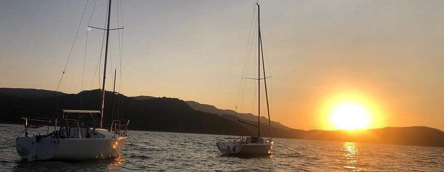 sailboats with sunset