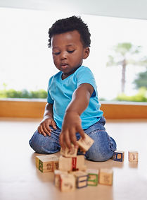 having-fun-learning-all-one-full-length-shot-baby-boy-playing-with-building-blocks-home (1