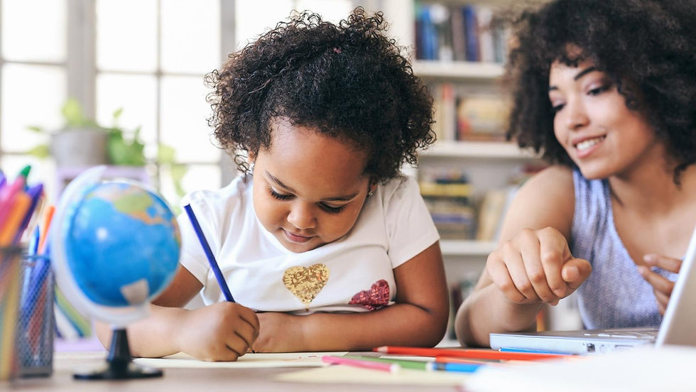 teacher helping a young preschool student