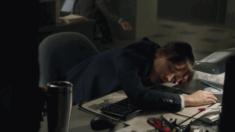 Woman falling asleep at her desk