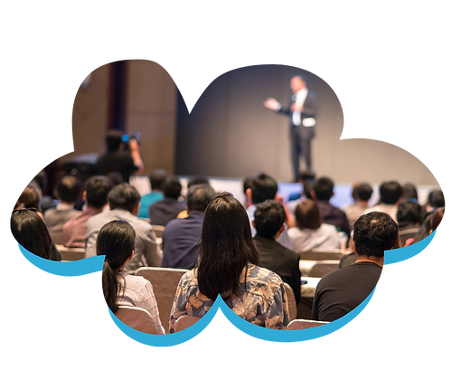 A man standing in front of a crowd giving a presentation