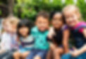 group-kindergarten-kids-friends-arm-around-sitting-smiling-fun.jpg