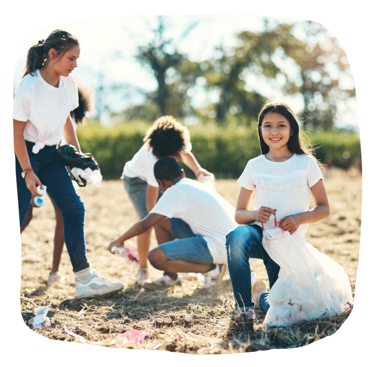 teen girls picking up trash