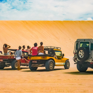 Group of People at Cars in Jericoacoara Dunes