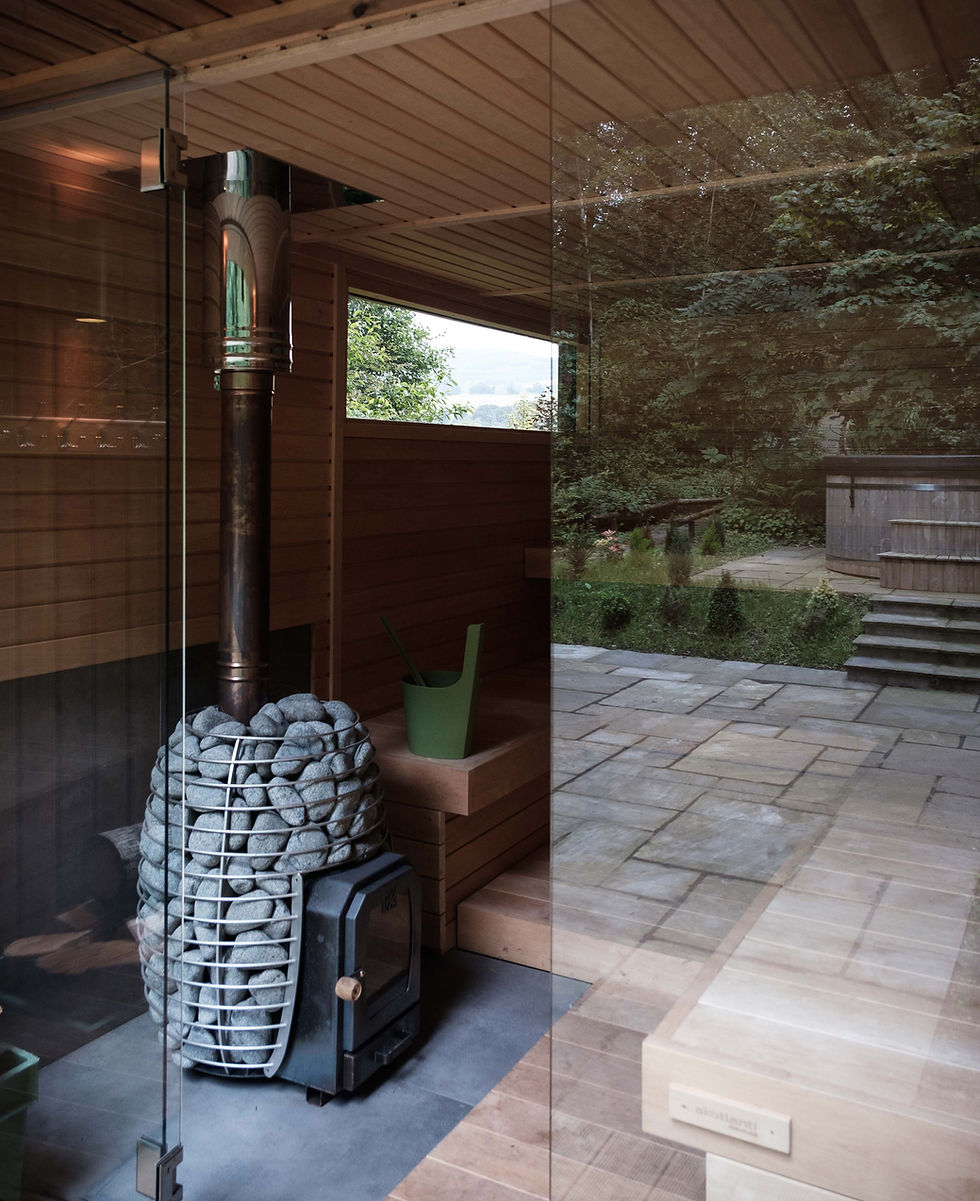 Outdoor wooden sauna surrounded by Scottish Highland forest