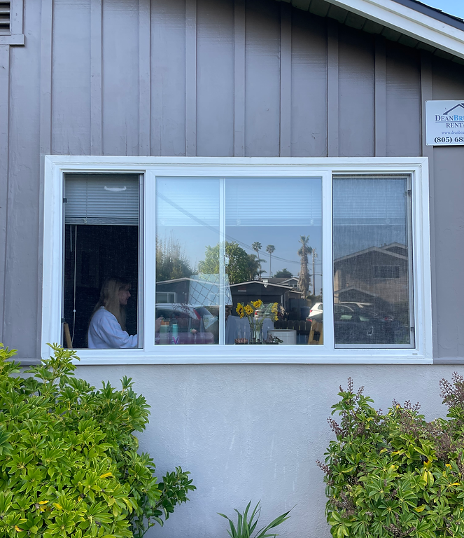 A landscape photo of a window during the daytime